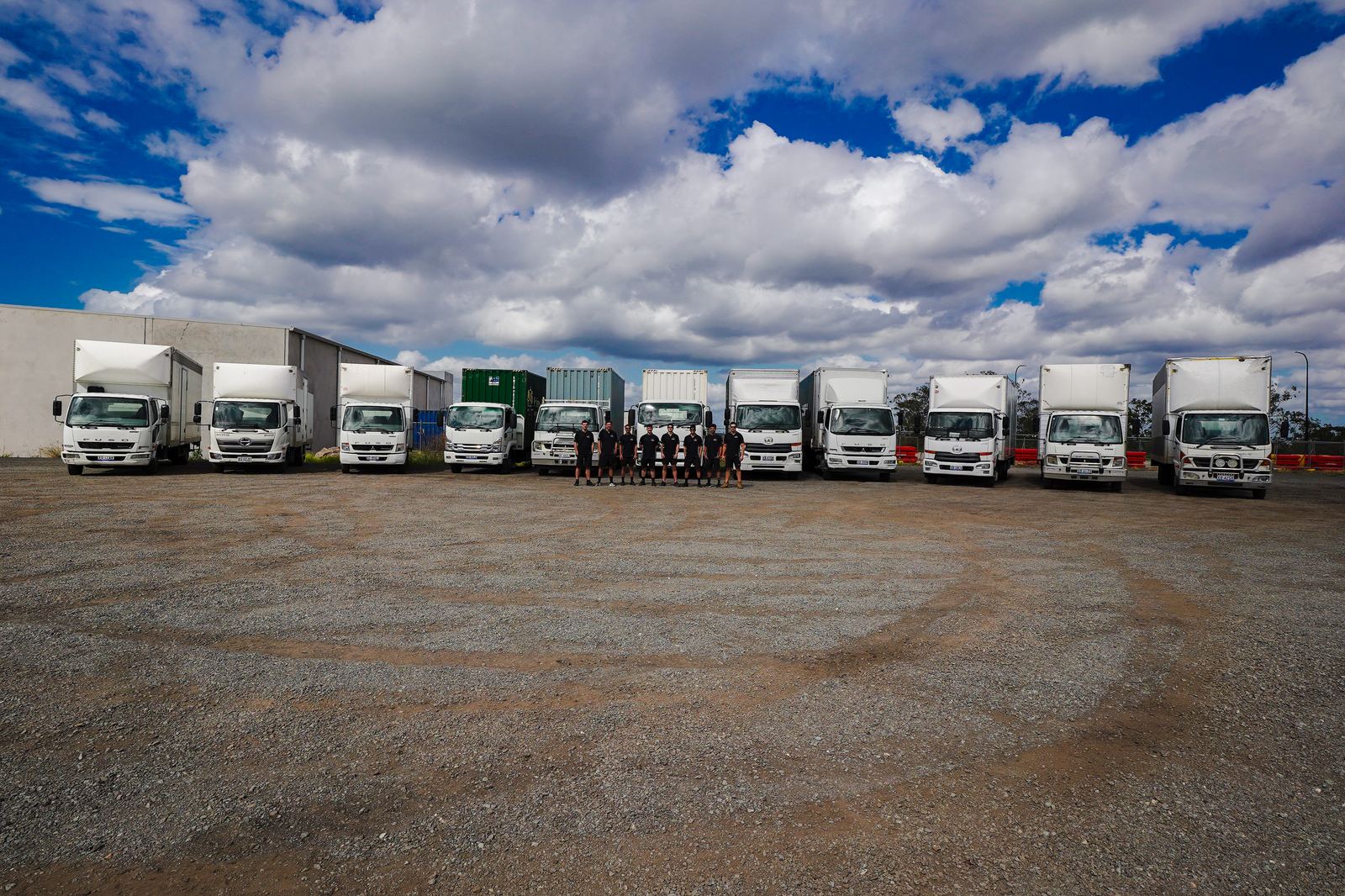 The Phoenix Removals Brisbane fleet lined up at the depot